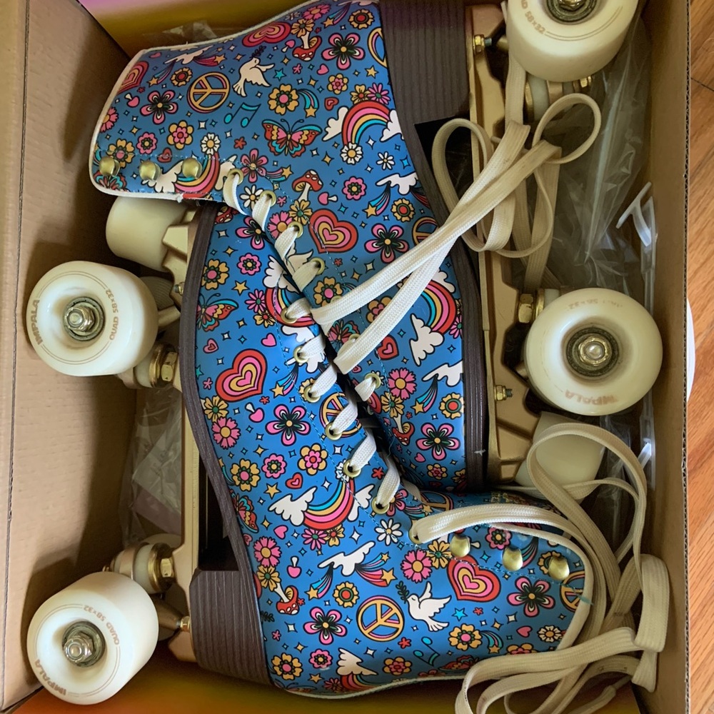 Impala quad roller skates in Harmony print. Peace, love, and sunshine!